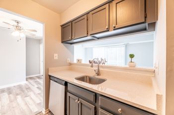A kitchen with a sink and a window at BellaVista Apartments in Woodbridge, VA